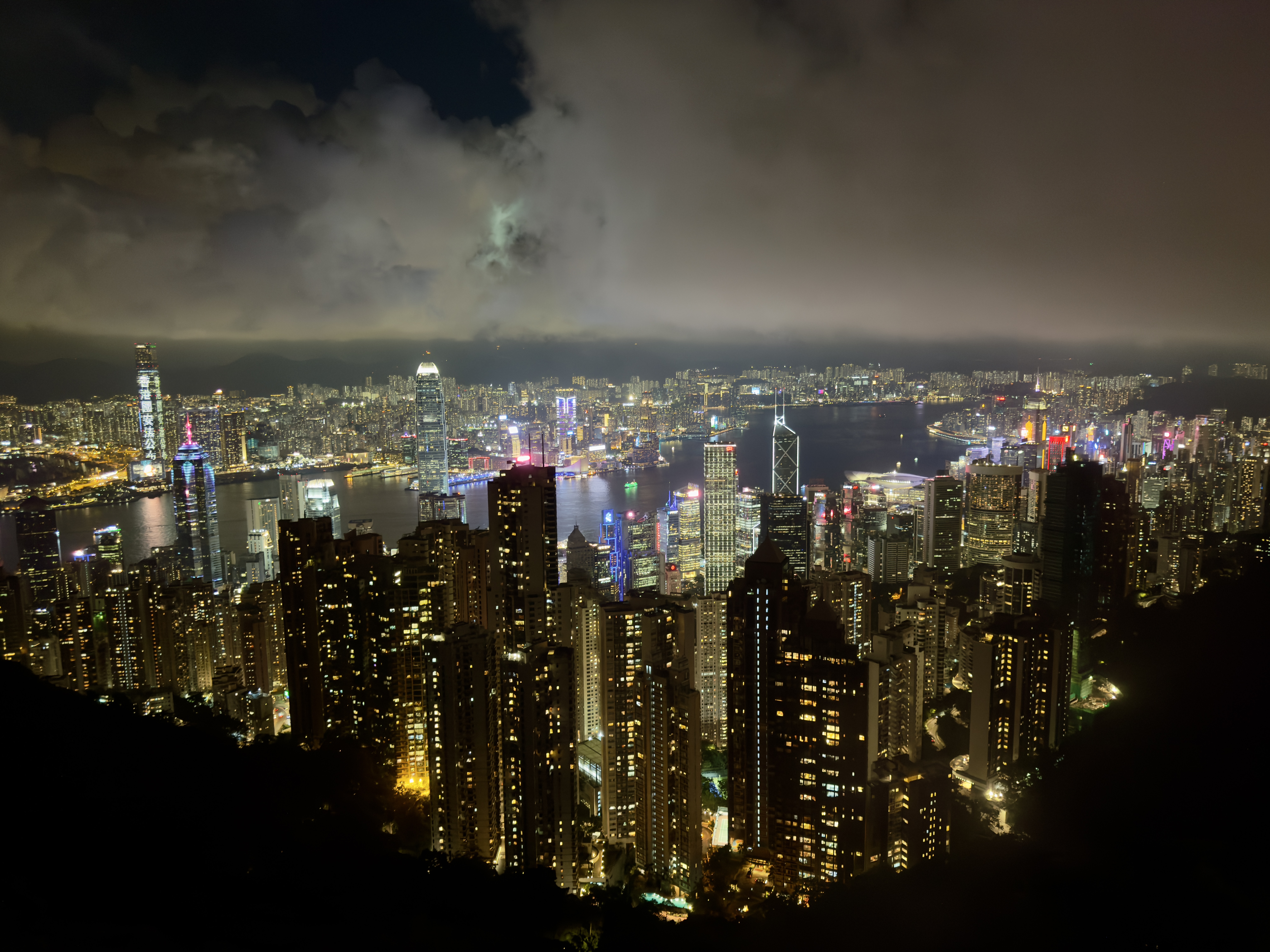 Hong Kong skyline and harbour illuminated at night