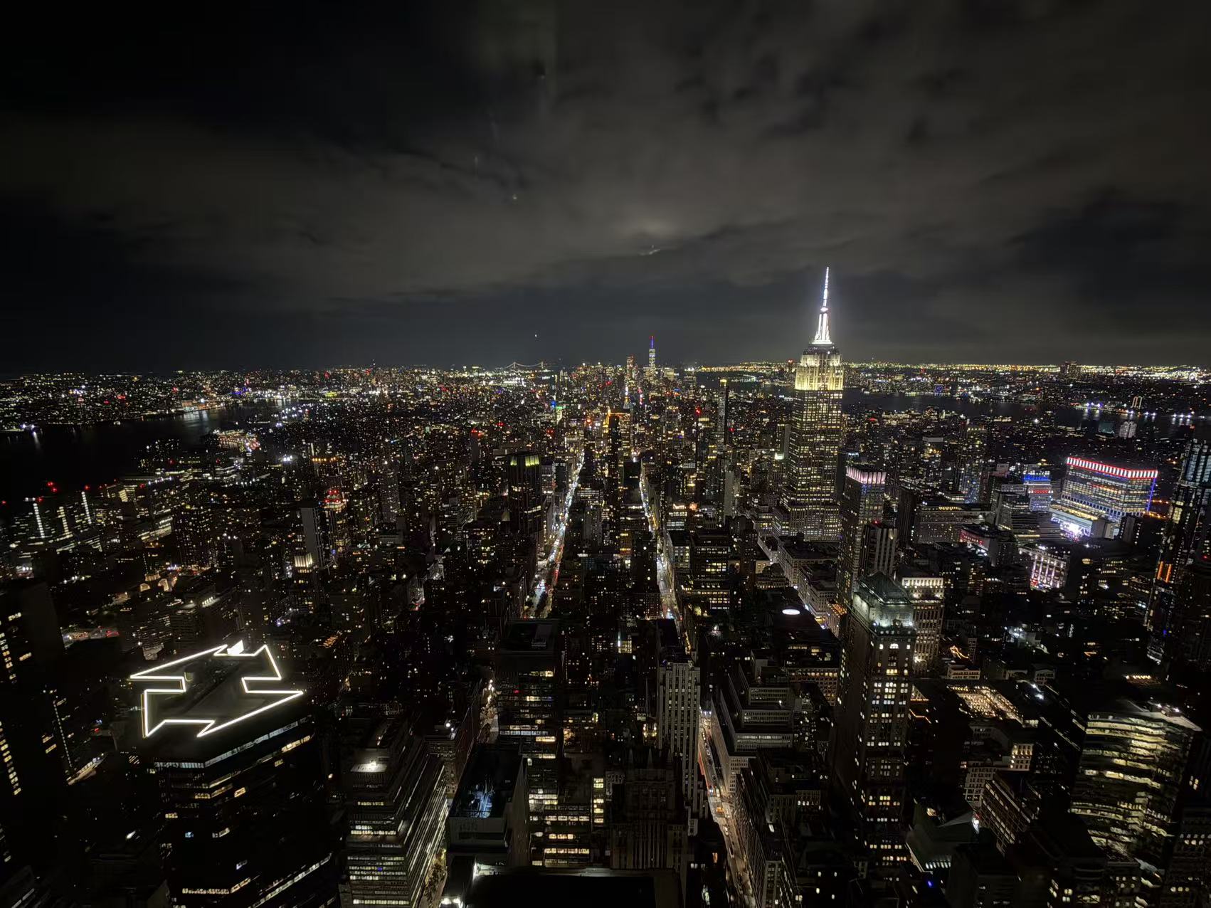 Manhattan skyline at night with the illuminated Empire State Building
